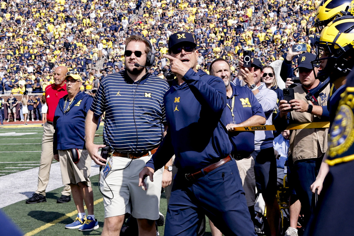 Sep 23, 2023; Ann Arbor, Michigan, USA; Michigan Wolverines head coach Jim Harbaugh leads his players before a game against the Rutgers Scarlet Knights at Michigan Stadium. Mandatory Credit: Rick Osentoski-USA TODAY Sports